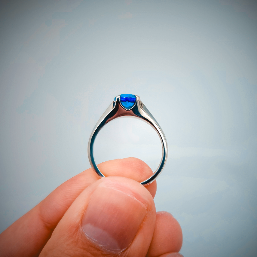 Fingers Holding Ring, Blue Stone Ring, Blue Topaz, Solitaire Setting, Ocean blue gemstone, Sterling Silver Ring, Silver Ring, White Gold Ring, Gold, Magic Ring, Fantasy Ring, Solid Gold Ring, Eldridge Jewelry